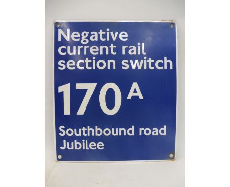 An Underground Railway enamel sign for attaching to a cabinet bearing the words 'Negative Current Rail Section Switch 170A So