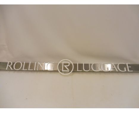 A Rolling Luggage rectangular enamel sign, 78 3/4 x 7 3/4".