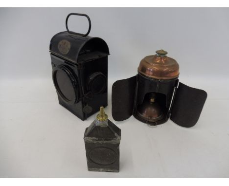 A black enamel railway lamp bearing label for E.R. 1964 SNLW Ltd. plus an unusual steel and copper hand held lamp possibly co