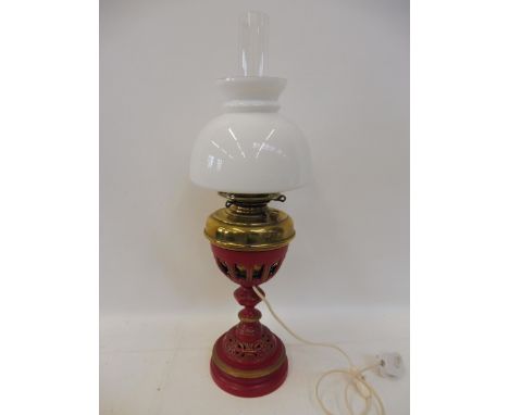 A rare G.W.R cast iron and brass railway carriage oil lamp, stamped underneath: GWR, electrified and with glass shade and fun