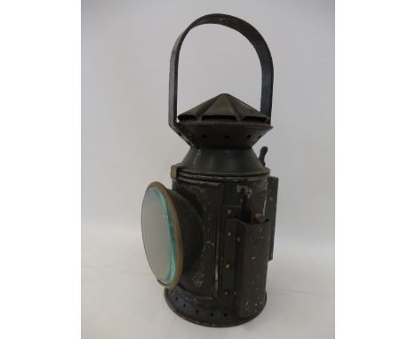 A Harry J. Pratt &amp; Co. Ltd. war time hand held lamp, in green livery dated 1945, bearing a brass plaque. 
