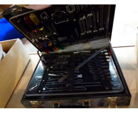 Briefcase with fitted tool interior and tools