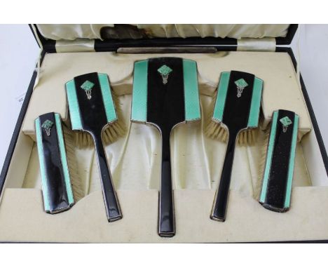 Deakin and Francis Ltd, an Art Deco dressing table set, silver having black and green enamel with a marcasite and carved jade