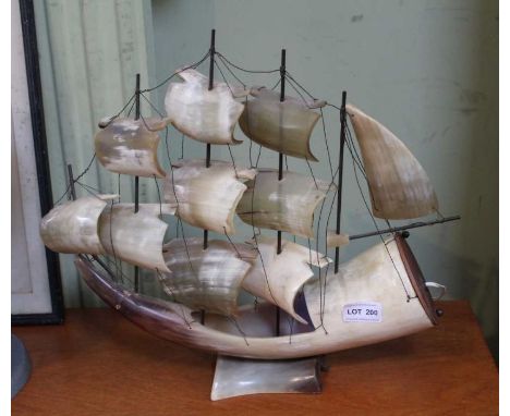 A working novelty lamp made from horn depicting a sailing ship