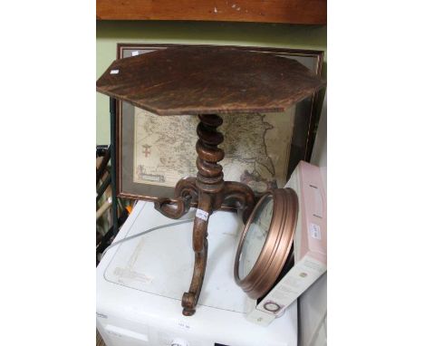 An oak wine table on barley twist stem tripod base