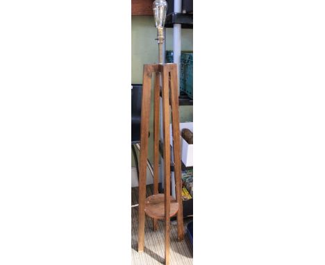 A modern design free standing wooden floor lamp with filament bulb