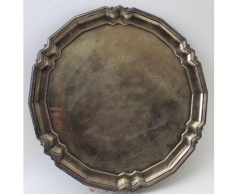 A Mappin and Webb silver salver of Georgian design, piecrust rim raised on three feet, Sheffield 1932, 30.5 cm dia, 810g (pre