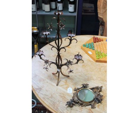 19th century cast and gilded floral design mirror and a metal five sconce candlestick