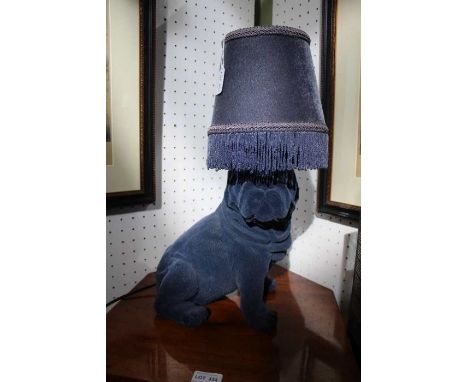 A textured 'blue pug' lamp with tasselled shade