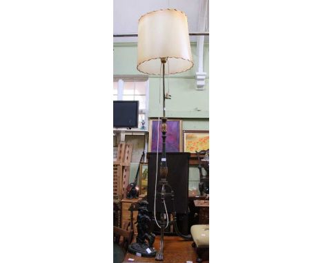 A probable 19th century carved wood gilt gesso tripod base telescopic standard lamp