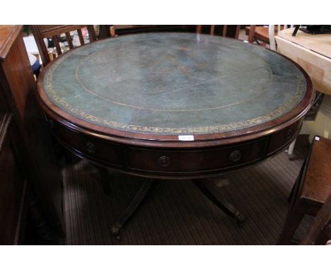 A possible19th century large circular drum table with inset gilt leather top