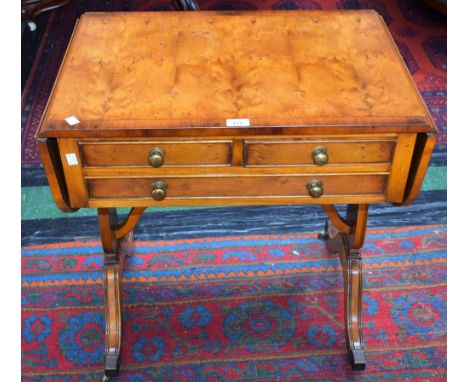 A Bevan Funnell Reprodux sofa table, rectangular top with fall leaves above two short and one long drawer, vasular shaped end