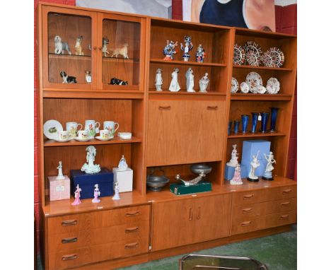 A retro mid-20th century design G Plan side cabinet, composed of three individual sections, the left with a pair of glazed do