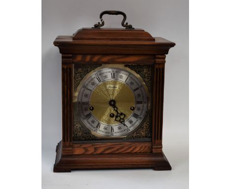 A 20th century American light oak cased Westminster chiming bracket clock, by Linden, brass dial, brushed steel chapter ring 