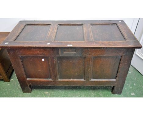 An 18th century oak three panel blanket chest, later amendments