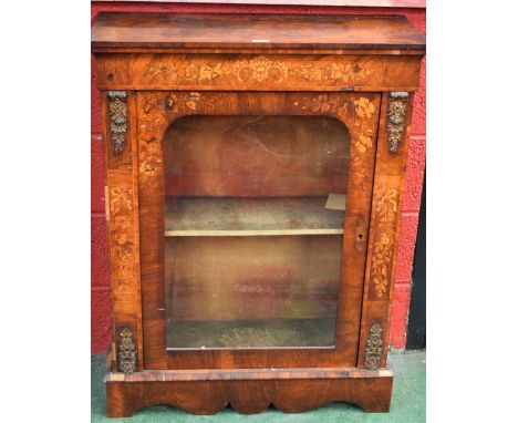 A Victorian gilt metal mounted marquetry pier cabinet, rectangular top above a glazed door enclosing a shelf, inlaid througho