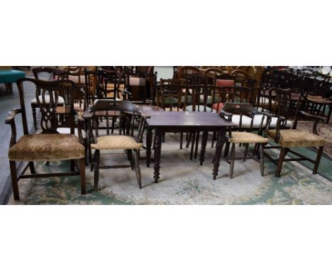 A late Victorian mahogany table; a pair of Chippendale Revival type armchairs; two smoker's bow chairs (5)