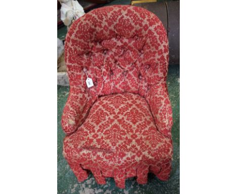 A Victorian child's button back upholstered chair, turned forelegs