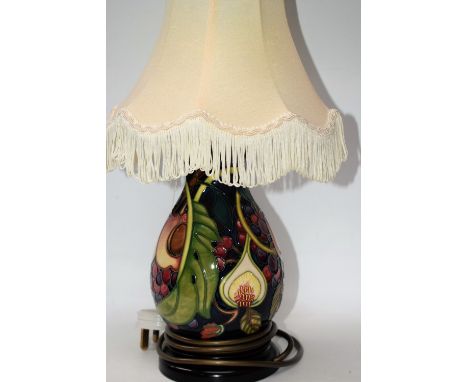 A Moorcroft Queens Fruit pattern baluster table lamp, tube lined with ripe peaches, figs, grapes and vine leaves, in bright c