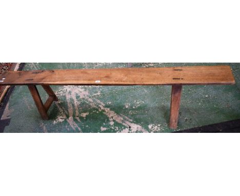 A rustic elm topped bench, rectangular top, legs and stretchers, 197cm long