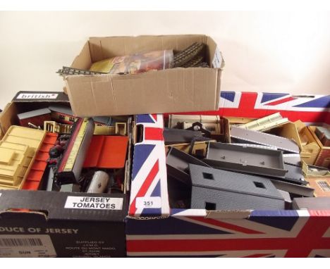 A Hornby Dublo three rail train set with red 16440 engine, two carriages, wagons, station, buildings and accessories 
