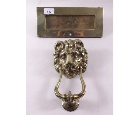 An old brass lion door knocker and letter box 