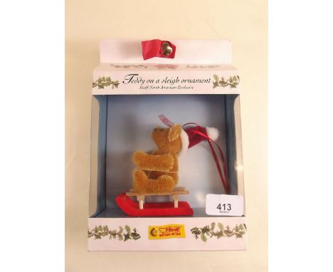 A Steiff limited edition teddy on a sleigh with label 1442/2003, boxed with certificate 