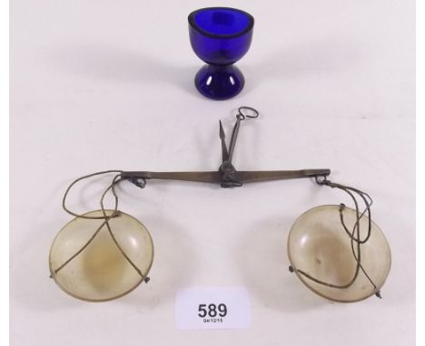 A set of antique apothecaries scales and a Bristol blue eyebath 