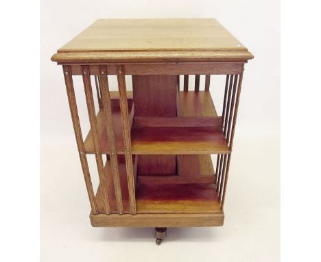 An Edwardian light oak revolving bookcase 