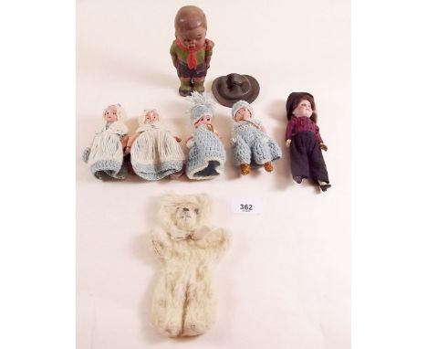 A composite boy scout doll 13cm, a bisque small doll, a teddy and four celluloid kewpie dolls