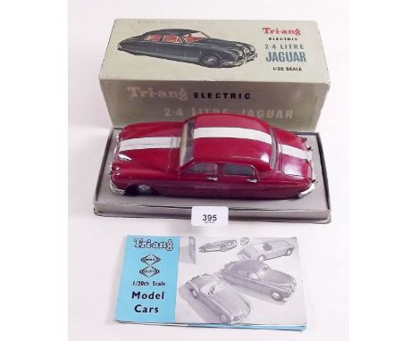 A Triang 1:20 scale battery operated 2-4 litre Jaguar boxed with promotional leaflet 