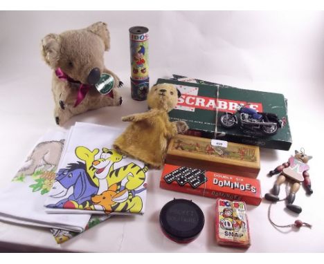 A box of mixed toys and games including early Sooty hand puppet