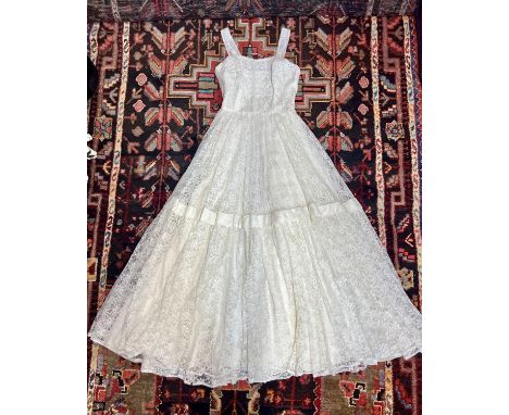 1970s original white lace wedding dress with applique daisy detail at the front and lace bolero jacket.(Small holes in the ba