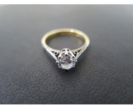 An 18ct and platinum solitaire diamond ring size K - approx weight 2.7 grams - diamond approx 0.6ct - minor usage wear, small