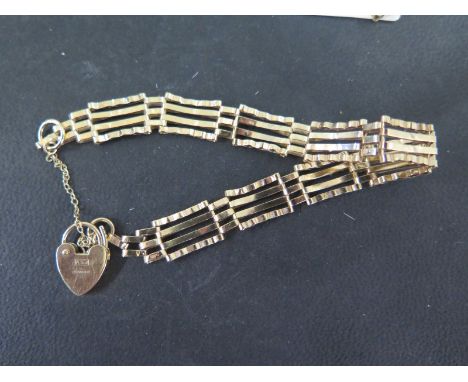 A 9ct yellow gold gate link bracelet - approx weight 7 grams - some usage bending but generally good