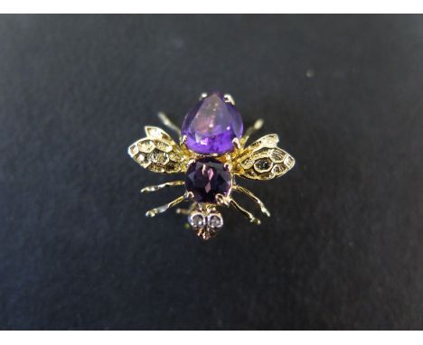 A 14ct yellow gold amethyst insect brooch maker KCJ - set with white stone eyes - 16mm x 18mm - approx weight 2.2 grams - app
