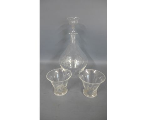 An Orrefors clear glass spirit decanter and two glasses - largest piece 16cm high - good used condition