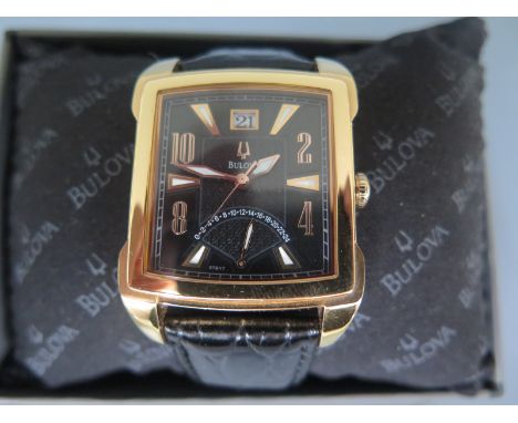 A gentleman's Bulova wristwatch in gold plated case, square black dial with Arabic numerals and baton markers, subsidiary 24 