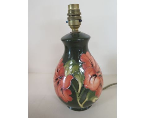 A Moorcroft Hibiscus pattern table lamp - no shade - Height 26cm including fittings Condition report: Minor surface scuffs ot