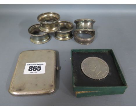 Five silver napkin rings and a silver cigarette case - Weight approx. 4.3 troy oz and a festival of Britain Crown 
