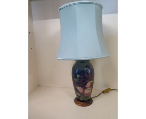 A Moorcroft Finches pattern table lamp with blue shade - Base height 28cm  - Height including shade 55cmCondition report: Goo