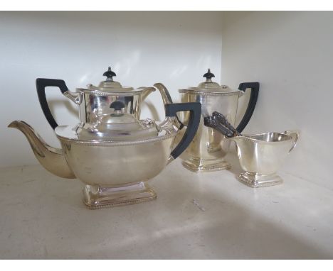 A silver plated four piece tea/coffee service plus further button hooks and plated spoons - good used condition