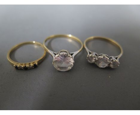 Two 9ct yellow gold dress rings, one with three stones to shoulder one with one large stone to shoulder - Size S/T & size R w