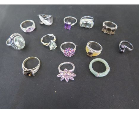 Twelve silver rings and a jade ring - all clean condition
