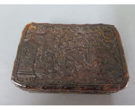 A 19th century Oriental carved tortoiseshell snuff box - 8cm x 2cm x 5.5cm - and a Bilston enamel box - 5cm wide - Oriental b