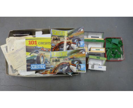 A collection of Scalextric to include seven cars, track and accessories and booklets Condition report: Playworn throughout 