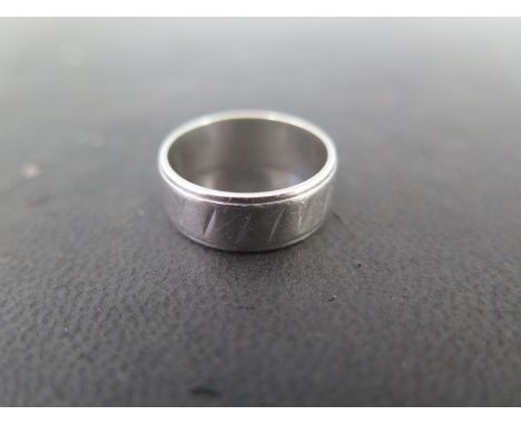 A platinum wedding band size K - approx weight 6.6 grams - some usage marks