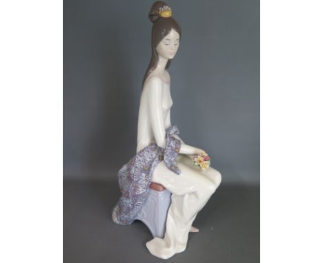 A Lladro figure of a seated girl - Height 39cm - marked as a second