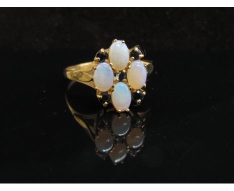 A 9ct gold opal and sapphire cluster ring. Size Y, 2.7g