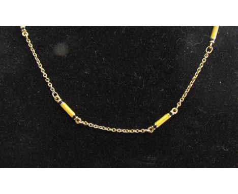 An 18ct gold necklace with yellow and black elongated enamel links, 46cm long, 13g